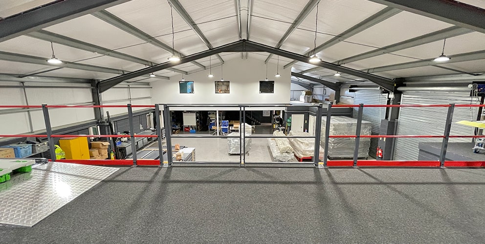 Durable Mezzanine floor with a pallet gate installed to overlook warehouse